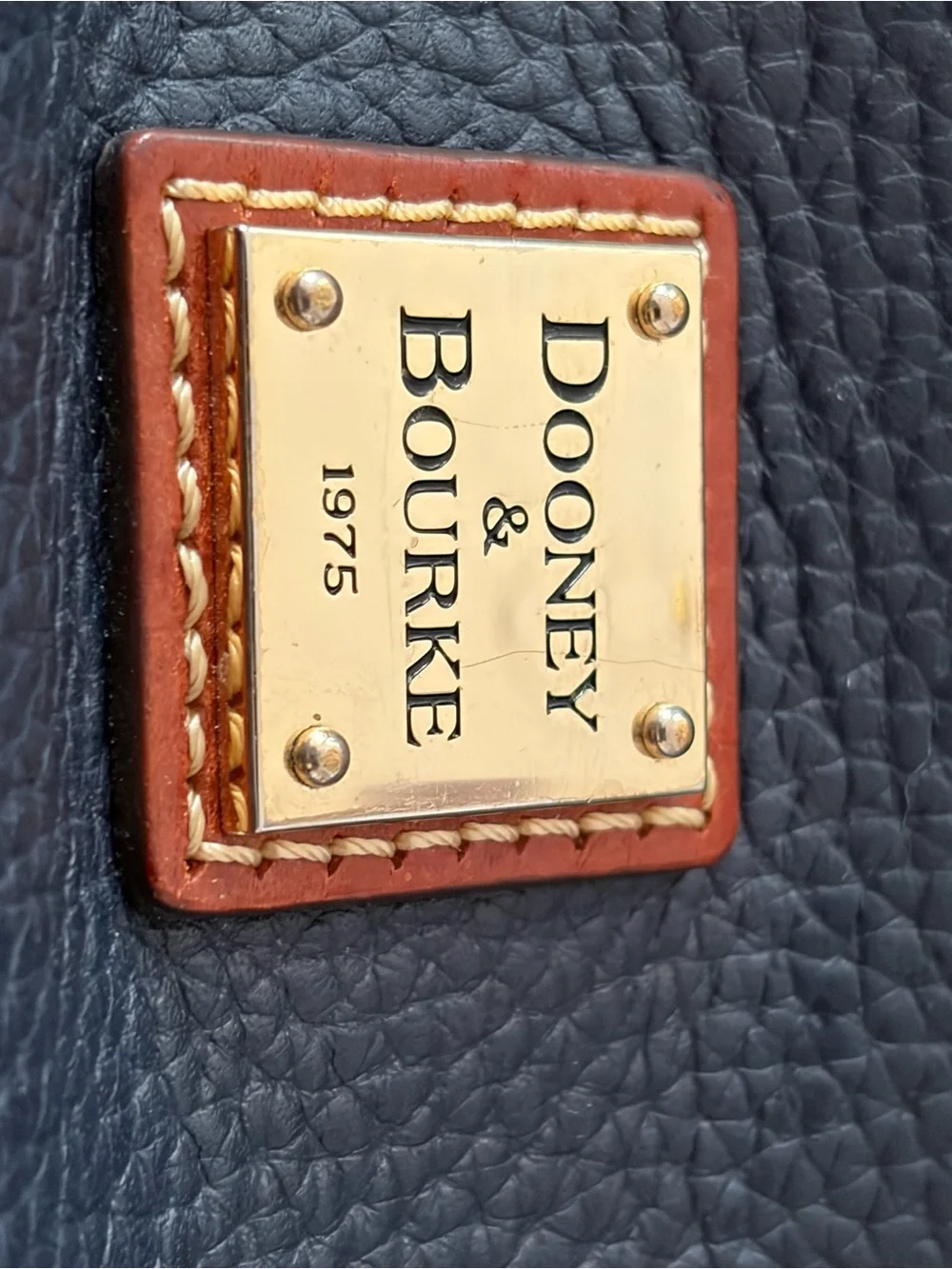 Dooney & Bourke Black Pebbled Leather Crossbody with Brown Trim & Gold Plate